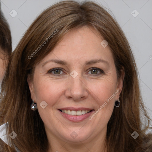 Joyful white adult female with long  brown hair and grey eyes