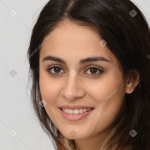 Joyful white young-adult female with long  brown hair and brown eyes