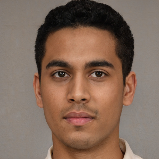 Neutral latino young-adult male with short  black hair and brown eyes