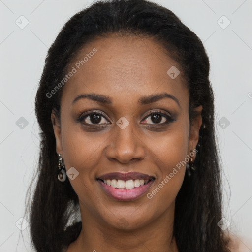 Joyful black young-adult female with long  brown hair and brown eyes