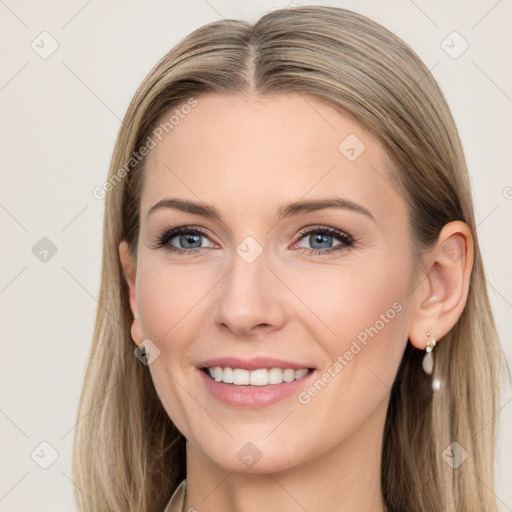 Joyful white young-adult female with long  brown hair and blue eyes