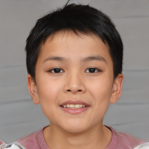 Joyful asian child female with short  brown hair and brown eyes