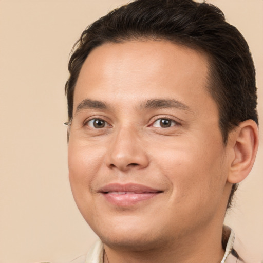 Joyful white young-adult male with short  brown hair and brown eyes