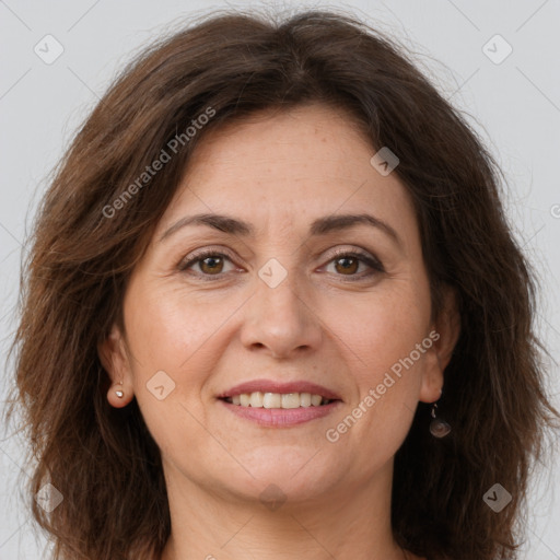 Joyful white adult female with long  brown hair and brown eyes