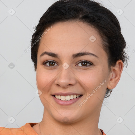 Joyful white young-adult female with short  brown hair and brown eyes