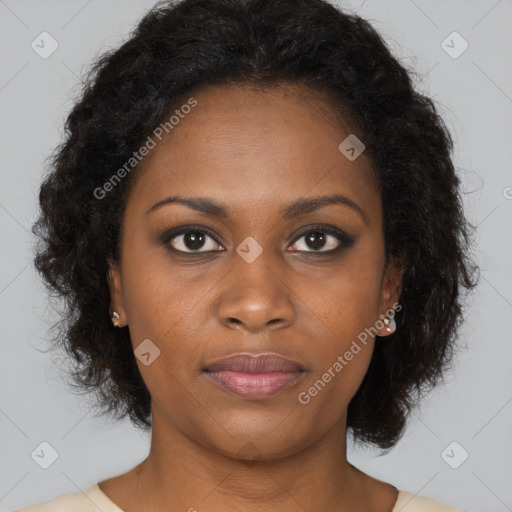 Joyful black young-adult female with long  brown hair and brown eyes