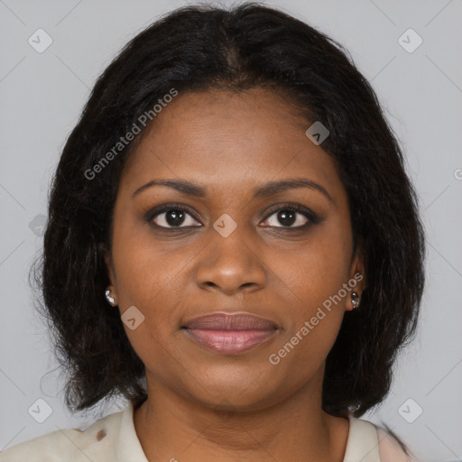 Joyful black young-adult female with long  brown hair and brown eyes