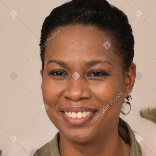 Joyful black young-adult female with short  brown hair and brown eyes