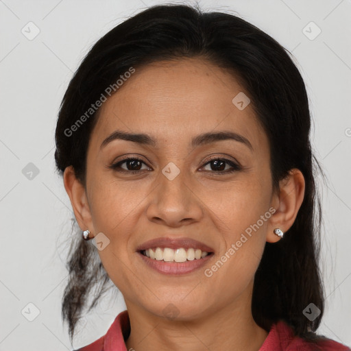 Joyful latino young-adult female with medium  brown hair and brown eyes