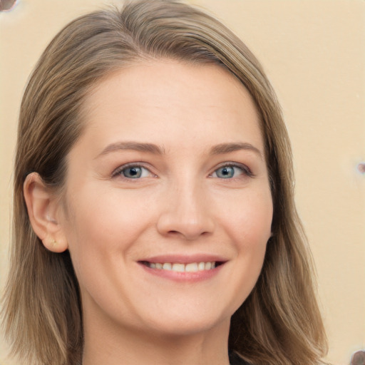 Joyful white young-adult female with long  brown hair and grey eyes