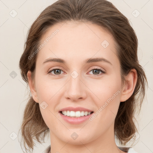 Joyful white young-adult female with medium  brown hair and green eyes