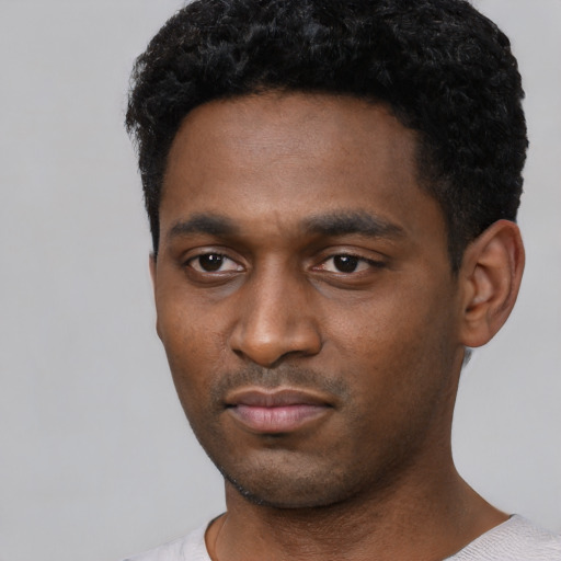 Neutral black young-adult male with short  black hair and brown eyes