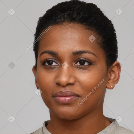 Joyful black young-adult female with short  black hair and brown eyes