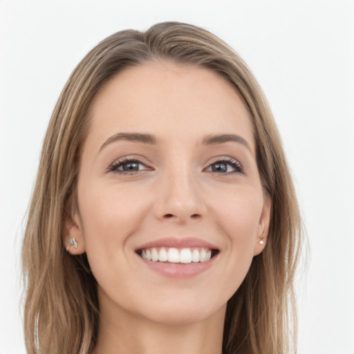 Joyful white young-adult female with long  brown hair and blue eyes