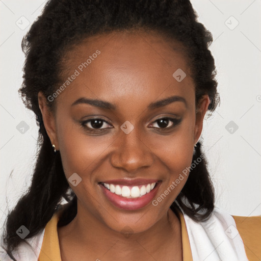 Joyful black young-adult female with long  brown hair and brown eyes