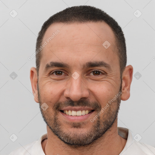 Joyful white adult male with short  black hair and brown eyes