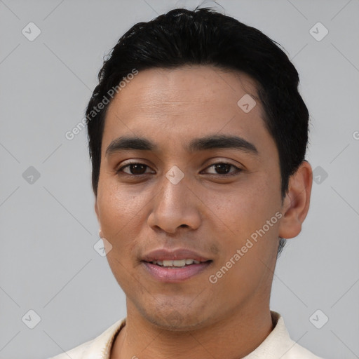 Joyful asian young-adult male with short  black hair and brown eyes