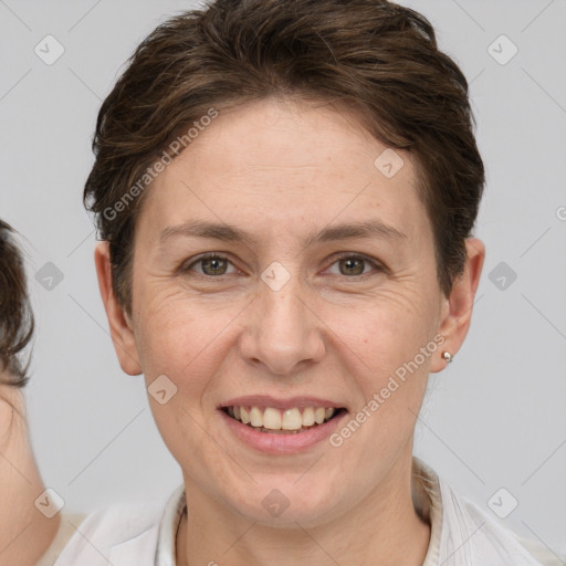 Joyful white adult female with short  brown hair and brown eyes