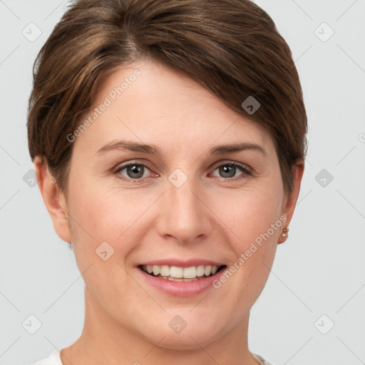 Joyful white young-adult female with short  brown hair and grey eyes