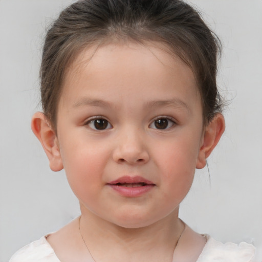 Joyful white child female with short  brown hair and brown eyes