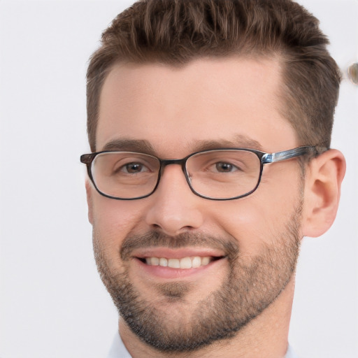 Joyful white adult male with short  brown hair and brown eyes