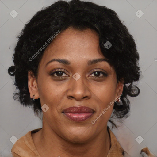 Joyful black adult female with short  brown hair and brown eyes