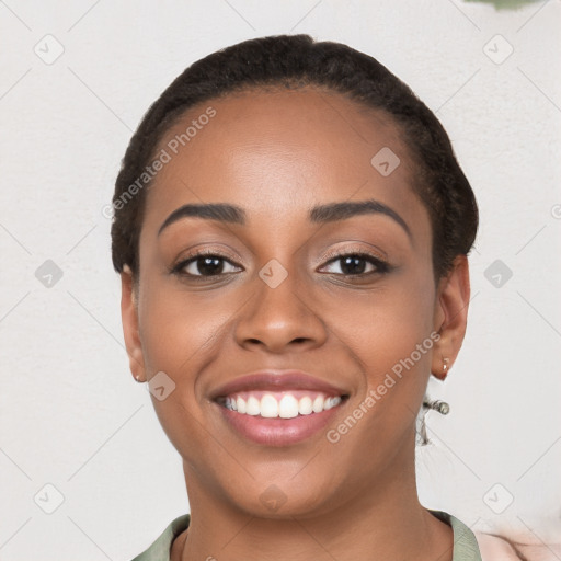 Joyful latino young-adult female with short  black hair and brown eyes