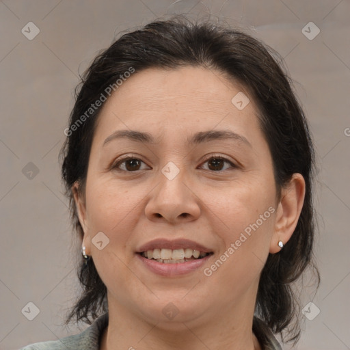 Joyful white adult female with medium  brown hair and brown eyes