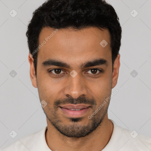 Joyful latino young-adult male with short  black hair and brown eyes