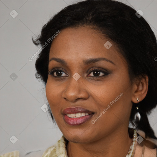 Joyful black adult female with medium  brown hair and brown eyes