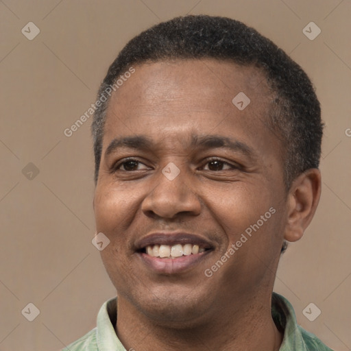 Joyful latino young-adult male with short  brown hair and brown eyes