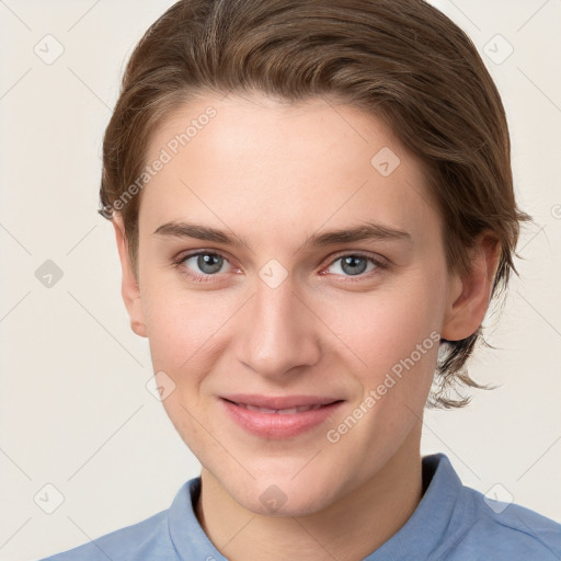 Joyful white young-adult female with short  brown hair and grey eyes