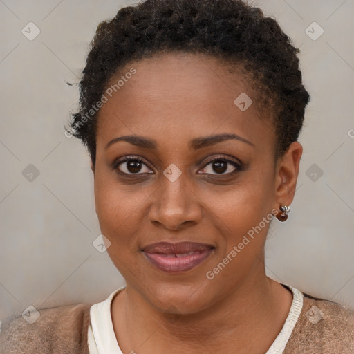 Joyful black young-adult female with short  brown hair and brown eyes