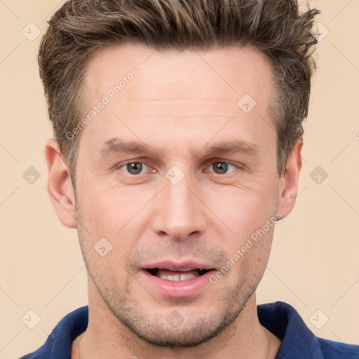 Joyful white adult male with short  brown hair and grey eyes