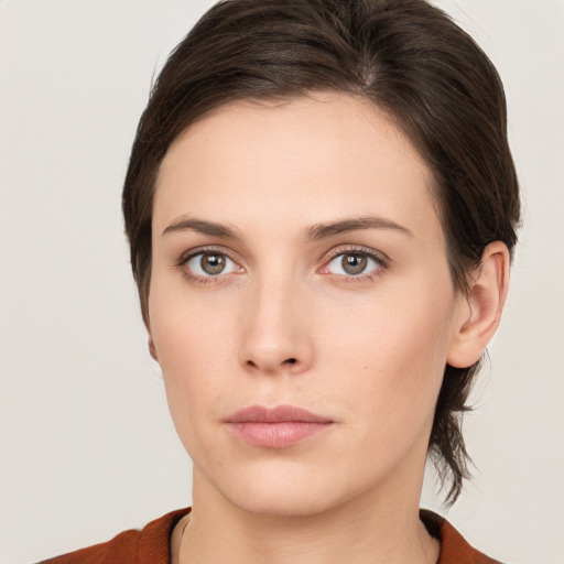 Neutral white young-adult female with medium  brown hair and brown eyes