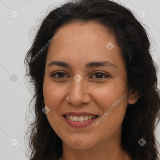 Joyful latino young-adult female with long  brown hair and brown eyes