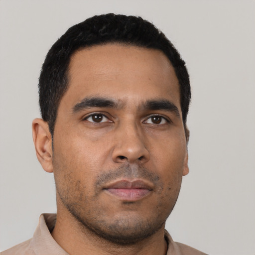 Neutral latino young-adult male with short  black hair and brown eyes