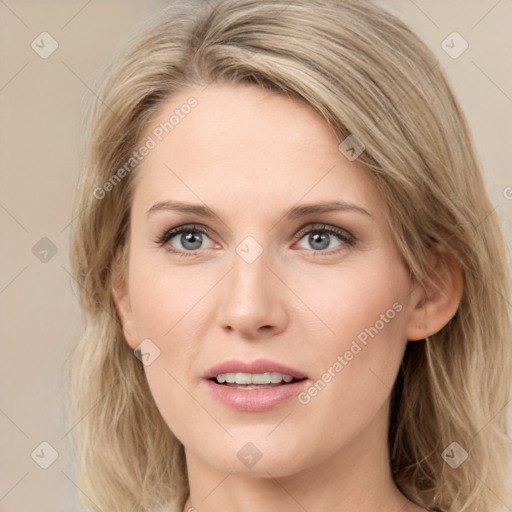 Joyful white young-adult female with medium  brown hair and blue eyes