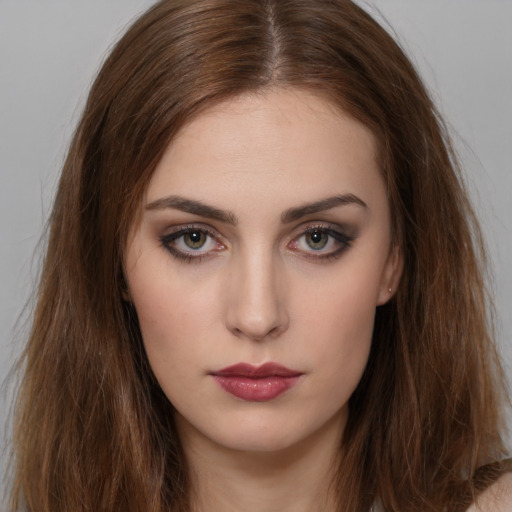 Neutral white young-adult female with long  brown hair and brown eyes