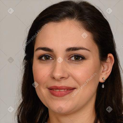 Joyful white young-adult female with long  brown hair and brown eyes