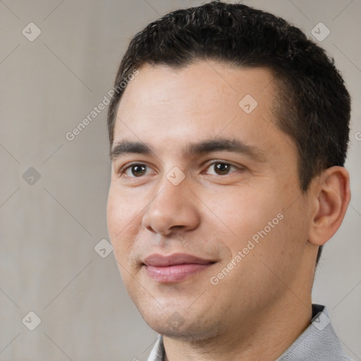 Joyful white young-adult male with short  black hair and brown eyes