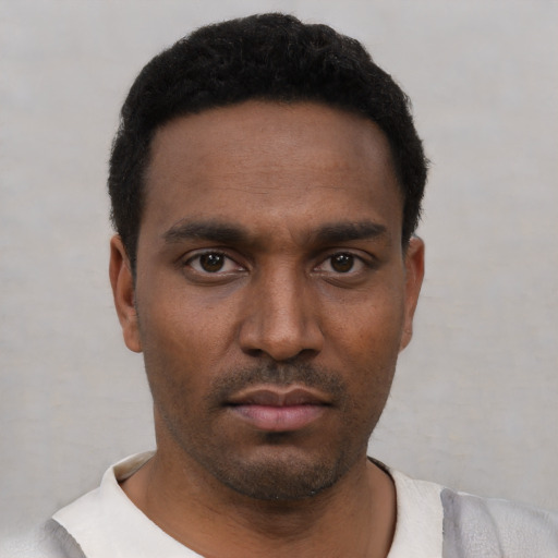 Neutral black young-adult male with short  black hair and brown eyes