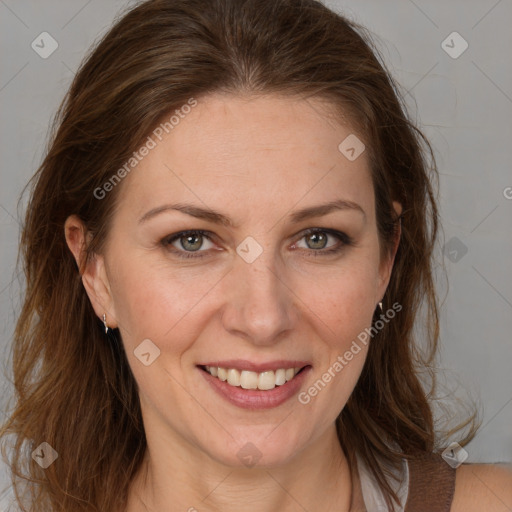 Joyful white adult female with long  brown hair and grey eyes