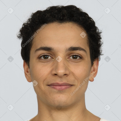 Joyful latino young-adult male with short  brown hair and brown eyes