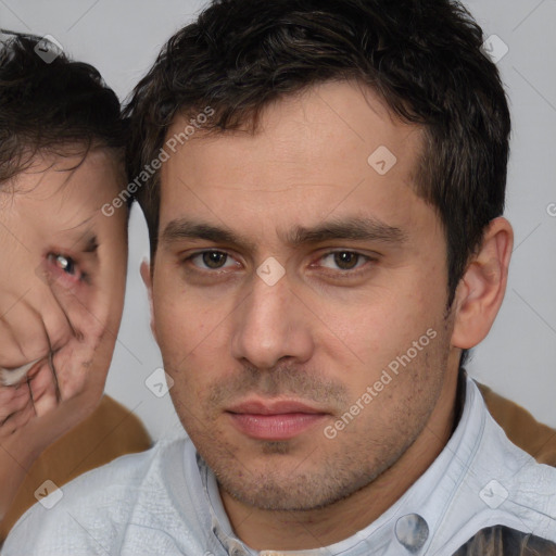 Neutral white young-adult male with short  brown hair and brown eyes