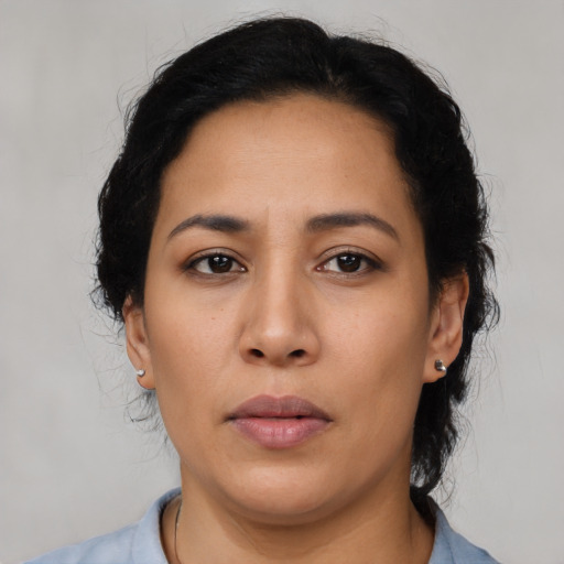 Neutral latino young-adult female with medium  brown hair and brown eyes