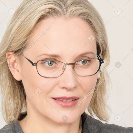 Joyful white adult female with medium  brown hair and blue eyes