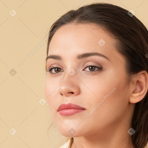 Neutral white young-adult female with long  brown hair and brown eyes