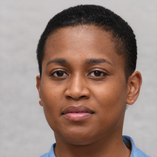 Joyful black young-adult female with short  brown hair and brown eyes
