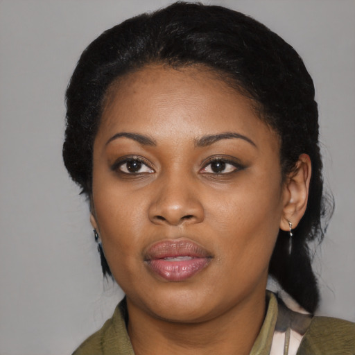Joyful black young-adult female with medium  black hair and brown eyes